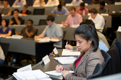 student studying in a large classroom