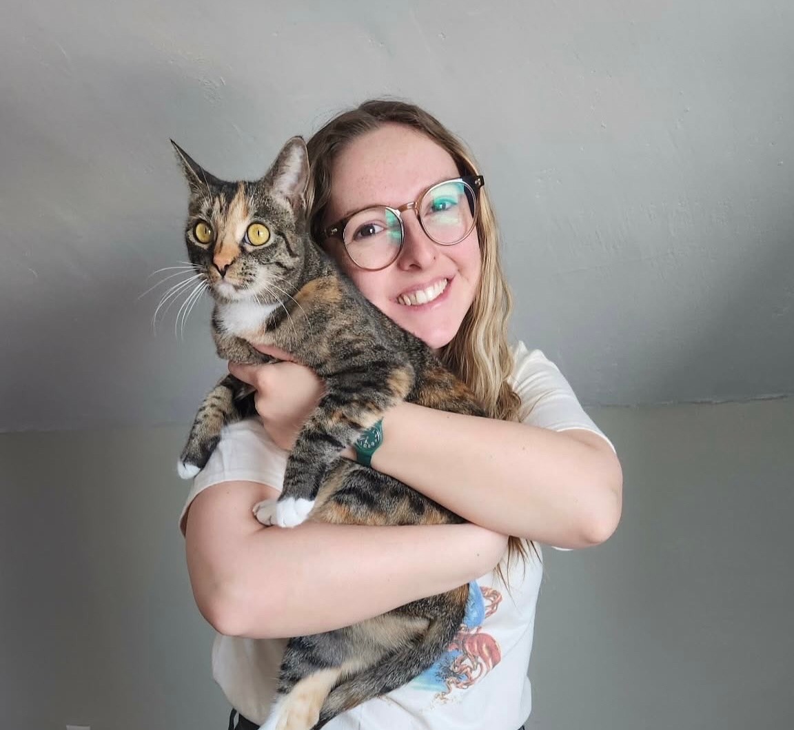 Yuxin holding a mammoth tusk at the University of Alaska Fairbanks Stable Isotope Facility.