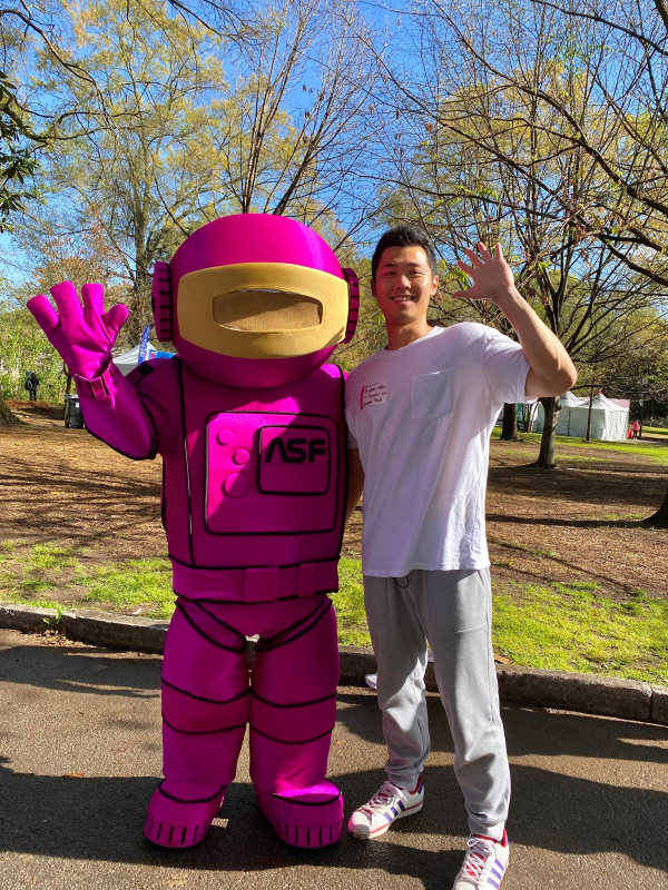 Yinghao Wen with the Atlanta Science Festival Mascot